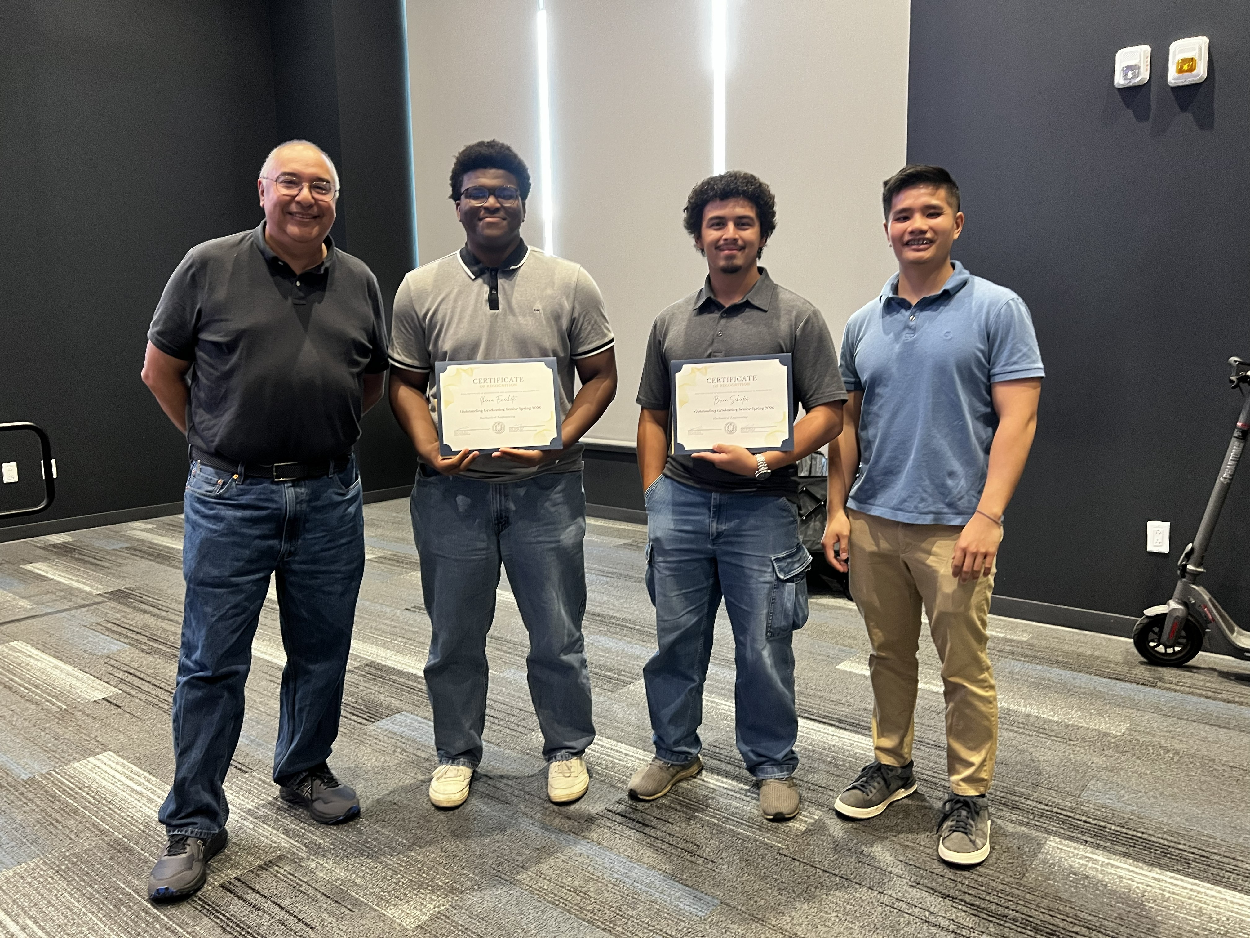 From left to right: Dr. Gerardo Diaz, award recipient Ikenna Emechete, award recipient Brian Sciefer, and Dr. Marcus Lee