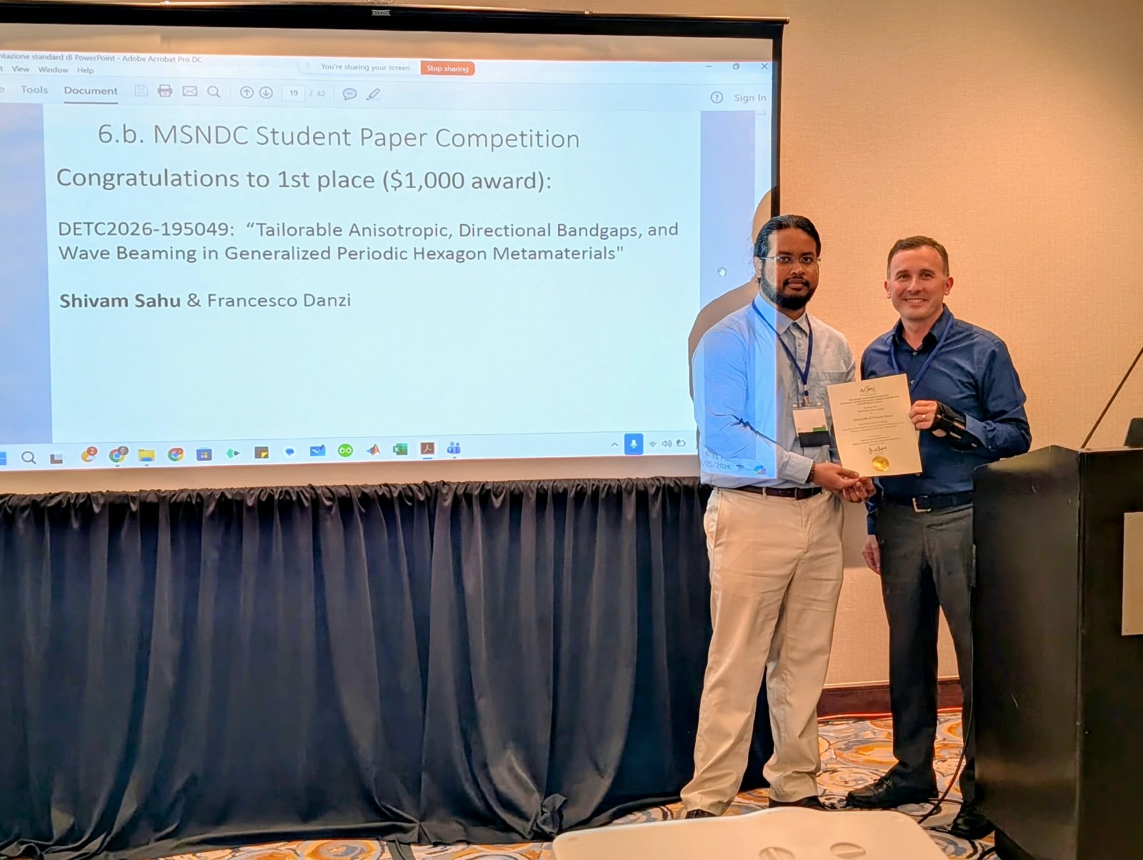 Shivam Sahu (left) receives Best Student Paper Award.